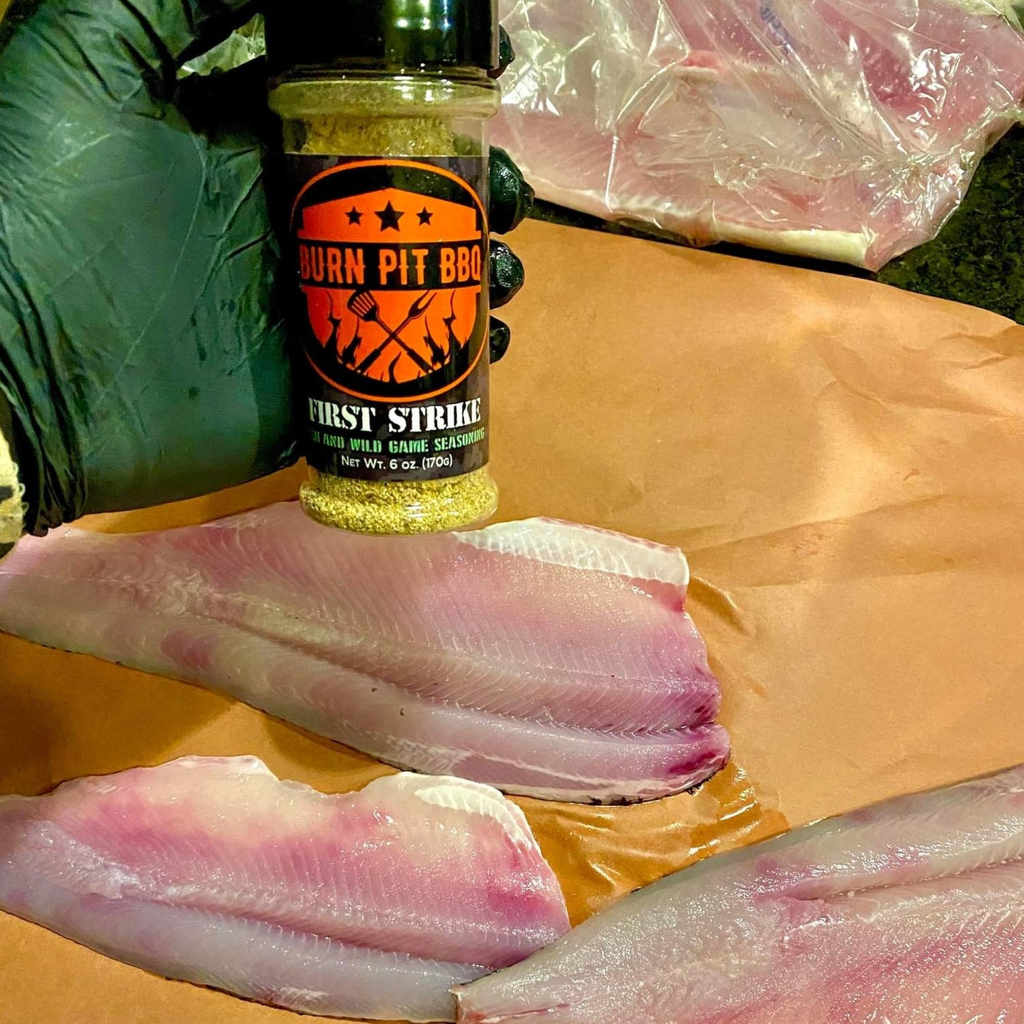 First Strike Seasoning With Fish On Table