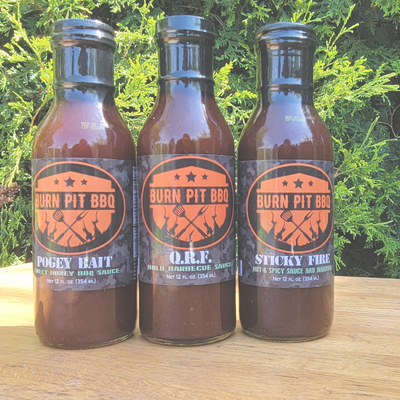 Burn Pit BBQ Sauces In Front of MRE